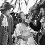 Errol Flynn, Olivia de Havilland, Henry Stephenson