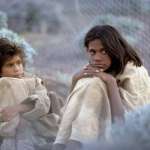 Everlyn Sampi, Laura Monaghan