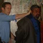 Jason Isaacs, John Cothran