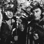 Patric Knowles, Herbert Mundin, Errol Flynn